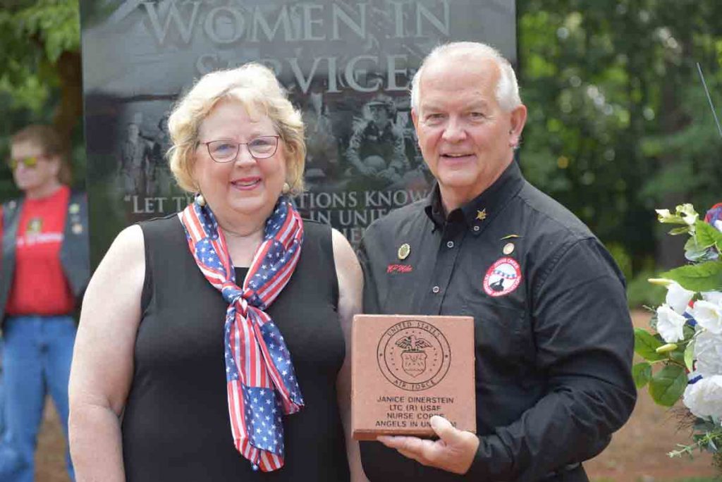 President Mike Mizell presenting paver to Janice Hiers